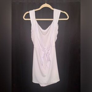 White dress, size XS but super stretchy so could fit a S. Never worn. No tag.